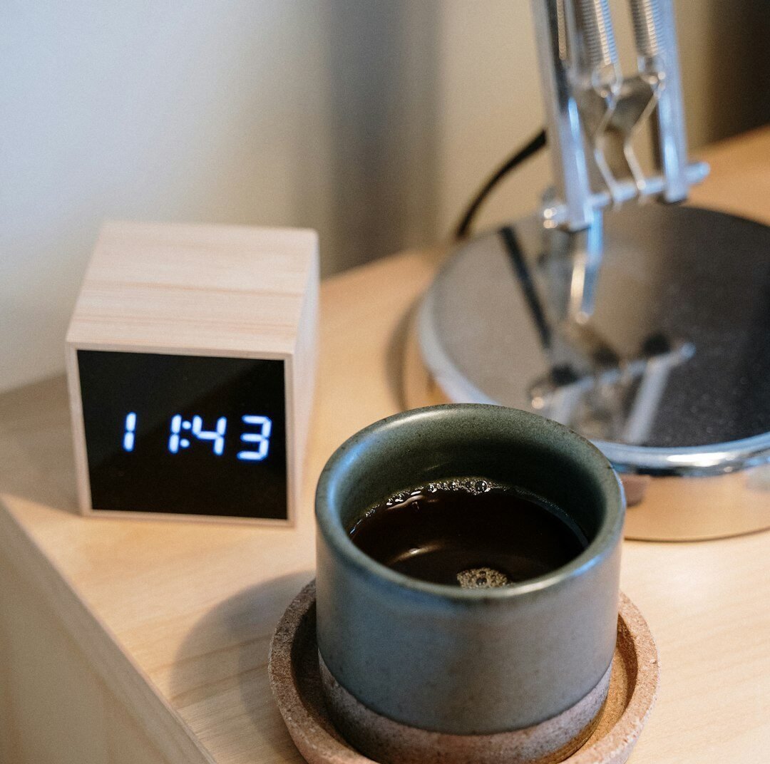 Clock and Coffee Cup on a Nightstand